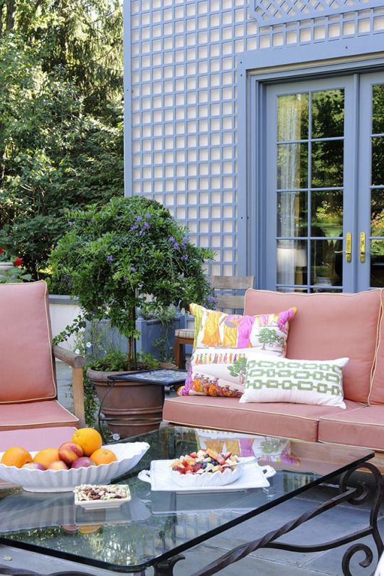 Patio with treillage and pink outdoor furniture