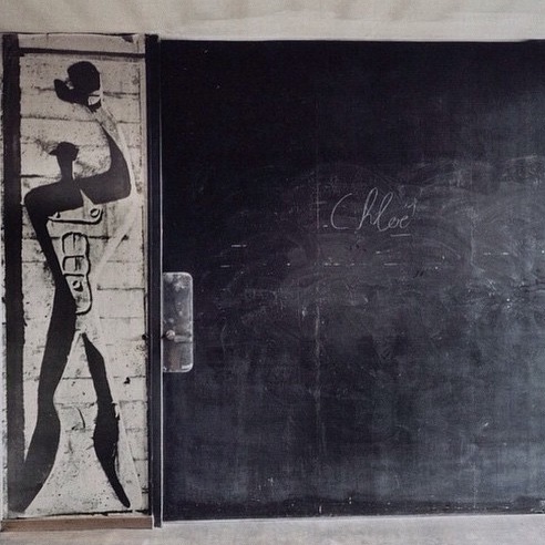 Unusual Black Sliding Door with painting of man holding hat