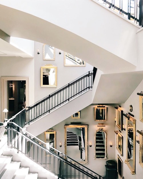 Grand Staircase filled with mirrors and picture lights